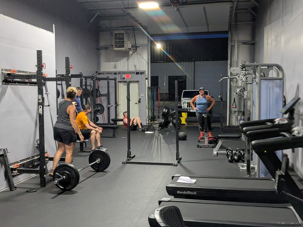 Members training on the STC gym floor