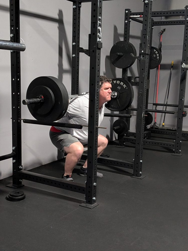 STC member performing a front squat